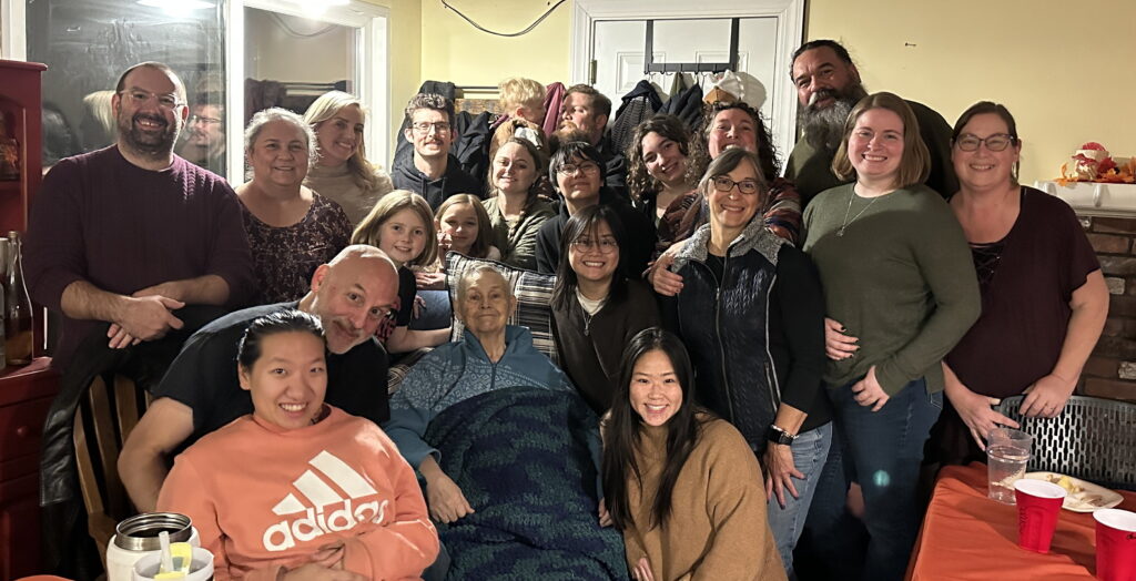 photo of Nancy surrounded by family at the Thanksgiving 2024 gathering